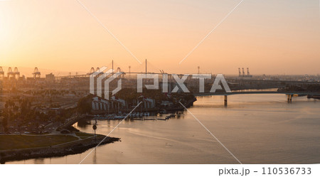 Thousands of shipping containers in the port of Long Beach near Los Angeles California. The Port of Long Beach in southern California during sunset. 110536733