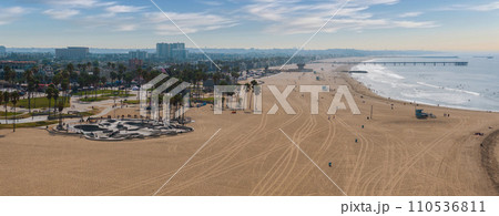 Skate board park in Venice beach with people skating by the Pacific ocean. Best and most popular skate park in the world. 110536811