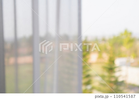 window curtain with green garden abstract blur background 110541587