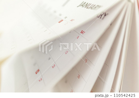Calendar page flipping sheet close up blur background business schedule planning appointment meeting concept 110542425