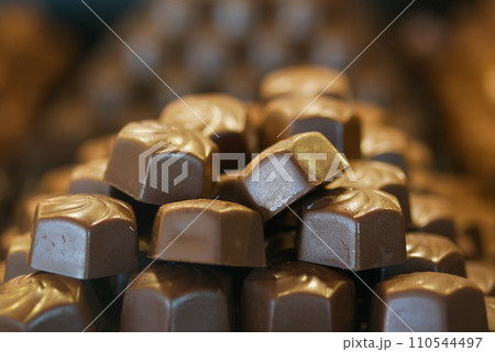 dark chocolate on a plate on table close up dark chocolate on a plate on table close up 110544497