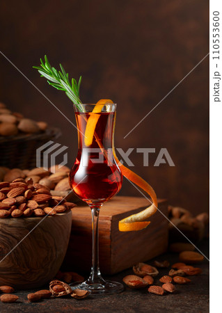 Italian liqueur Amaretto with almonds nuts. Italian liqueur Amaretto with almonds nuts. 110553600