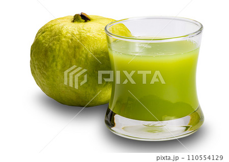 Closeup view of fresh green guava juice and ripe sweet guava fruit. 110554129