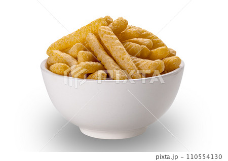 View of prawn cracker sticks in white ceramic bowl . 110554130