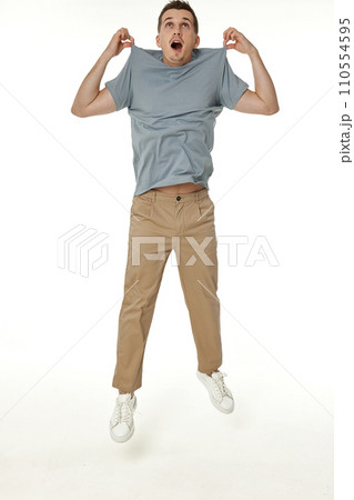 man holding himself by the shoulders isolated on white background man holding himself by the shoulders isolated on white background 110554595