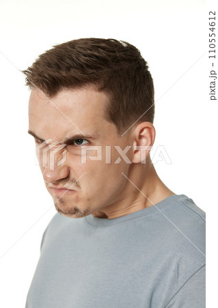 annoyed angry man shouting on white studio background 110554612
