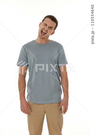 portrait of young happy man winking looking at the camera on white background portrait of young happy man winking looking at the camera on white background 110554640