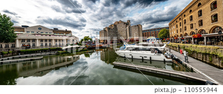Boats And Ships In St Katharine Docks With Office Buildings And Restaurants In London, United Kingdom 110555944
