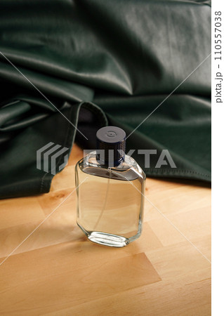 Perfume bottle on wooden table background.packaging design mock up. Scent fragrance cosmetic beauty product promo ad banner 110557038