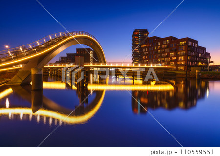 A bridge in the city at night. City lights. The Galaxy Bridge, Purmerend, Netherlands. 110559551