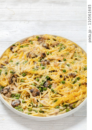 baked chicken tetrazzini in baking dish, top view baked chicken tetrazzini in baking dish, top view 110561685