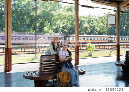 Asian woman friends at railway station have happy moment. Tourism and travel 110562214