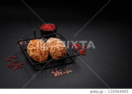 Delicious fresh cutlet or meatball Kiev style with filling 110564405