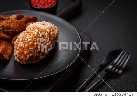 Delicious fresh cutlet or meatball Kiev style with filling 110564415