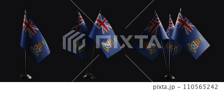 Small national flags of the Cayman Islands on a black background 110565242