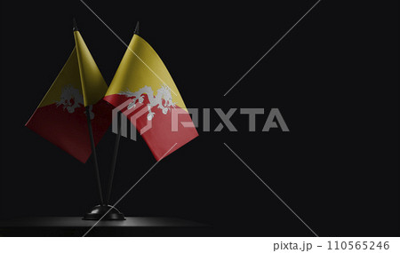 Small national flags of the Bhutan on a black background 110565246