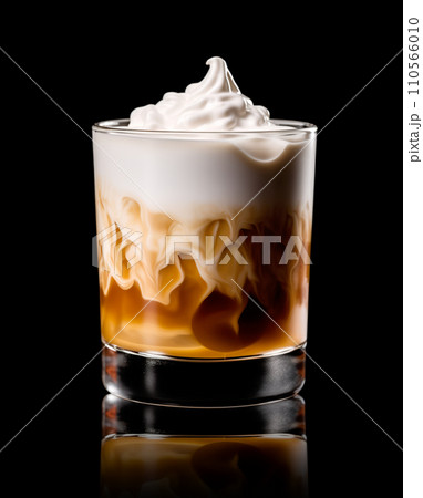 White Russian cocktail featuring layers of cream, coffee liqueur and vodka 110566010