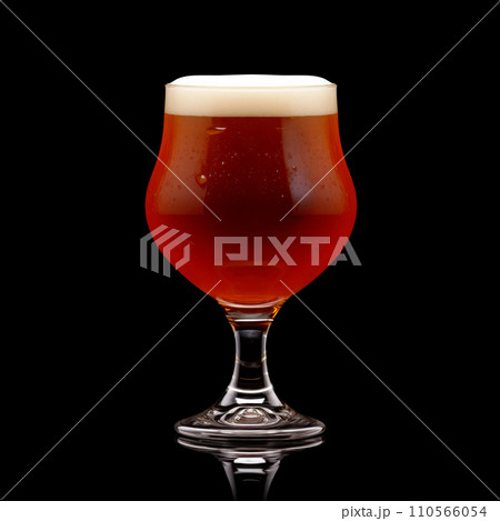 Beer in a tall glass on a dark black background. Mugs with drink like Ipa, Pale Ale, Pilsner, Porter or Stout 110566054