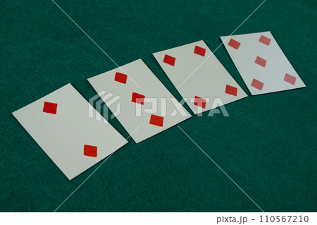 Old west era playing card on gambling table. 2,3,4,5 of diamonds. Old west era playing card on gambling table. 2,3,4,5 of diamonds. 110567210