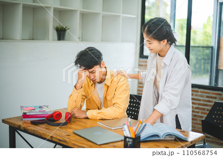 Fellow students are consoling friends who are disappointed in grades, frustrated with tasks that are not meeting their goals, helping each other. Fellow students are consoling friends who are disappointed in grades, frustrated with tasks that are not meeting their goals, helping each other. 110568754