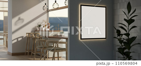 A frame mockup with a neon light attached to the wall in a modern, minimal cafe or restaurant. 110569804