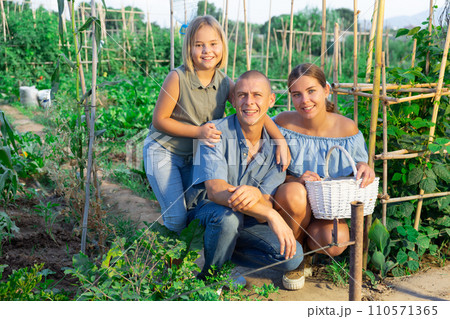 Portrait of family with their little daughter at their farm field Portrait of family with their little daughter at their farm field 110571365