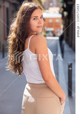 Portrait of an elegant woman on summer street of city Portrait of an elegant woman on summer street of city 110571883