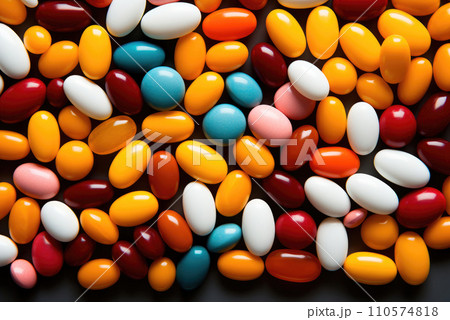 Tablets in bulk are multicolored on table. The concept of medicine, pharmacy Tablets in bulk are multicolored on table. The concept of medicine, pharmacy 110574818
