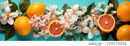 Summer banner made of tropical flowers and oranges on a turquoise background 110574856