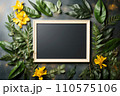 Blank frame surrounded by leaves and flowers. 110575106