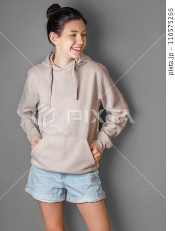 Portrait of a young pretty girl in a  hoodie 110575266