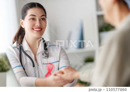 Female patient listening to doctor Female patient listening to doctor 110577860