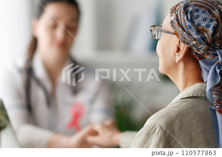 Female patient listening to doctor Female patient listening to doctor 110577863