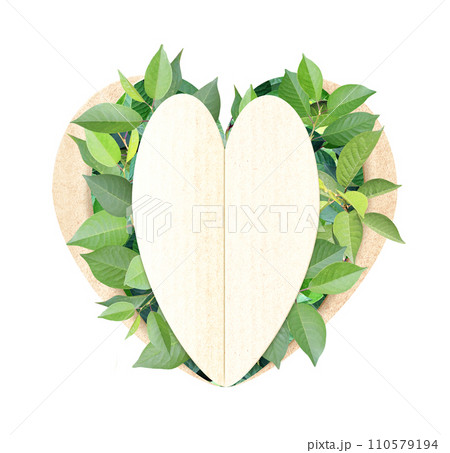 Heart shape hole and green leaves on cardboard texture. Isolated on white background. Recycled carton material. Ecology and zero waste concept. Copy space for text 110579194