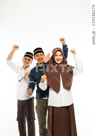 three islamic students standing together clenched their arm 110580279