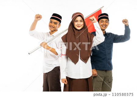 three islamic students standing clenched their arm 110580375