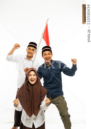 a group of islamic students standing clenched their arm 110580434