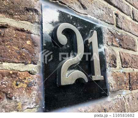 Close up of an house door number 21 Close up of an house door number 21 110581602