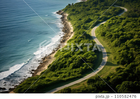 Winding Country Road Through Lush Green Forest and Mountains, sea beach 110582476