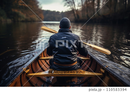 Generative AI a man rowing a wooden boat on a river 110583394