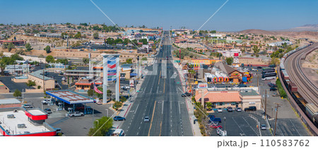 Aerial view of a southwestern urban landscape, showcasing a main road with modern and traditional businesses in Barstow, Nevada, USA. 110583762