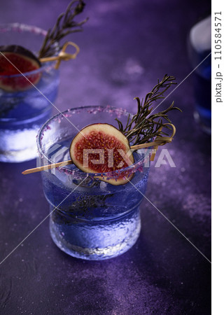 Purple fig cocktail or mocktail in glass Purple fig cocktail or mocktail in glass 110584571