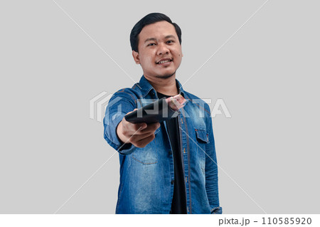 Young Asian man showing happy face expression Young Asian man showing happy face expression 110585920