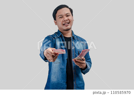 Young Asian man showing happy face expression 110585970