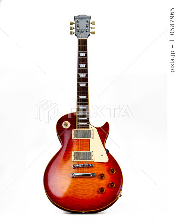 Electric guitar on a white background. Beautiful electric guitar isolated on a white background. Beautiful rosewood electric guitar 110587965