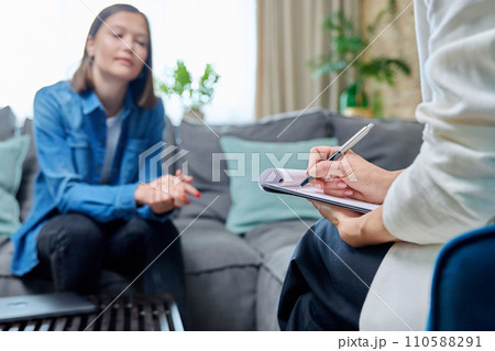 Close-up hands female mental specialist with clipboard working with patient Close-up hands female mental specialist with clipboard working with patient 110588291