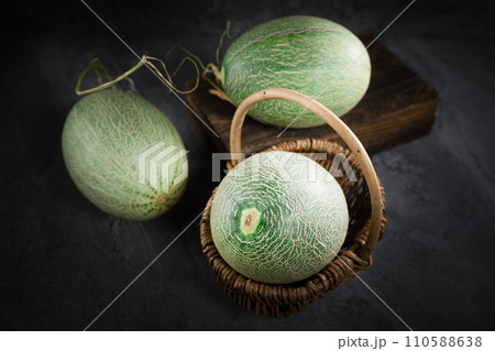 fresh melon on black background fresh melon on black background 110588638