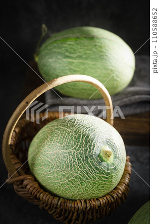fresh melon on black background fresh melon on black background 110588652