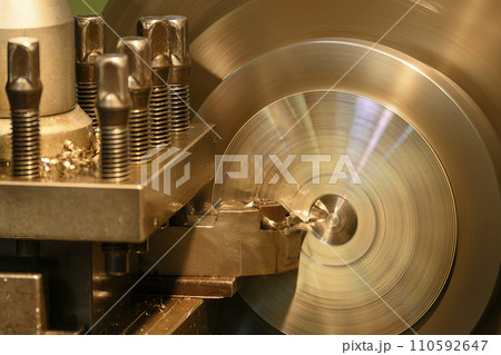 Closeup scene the lathe machine finish cut the metal parts by lathe tools. 110592647