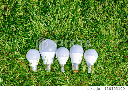 LED lamp bulb on green grass background LED lamp bulb on green grass background 110593100